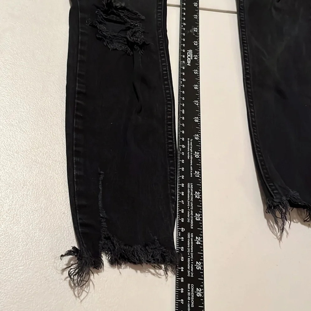 Free People size 27 Black Wash skinny jeans distressed with raw hem